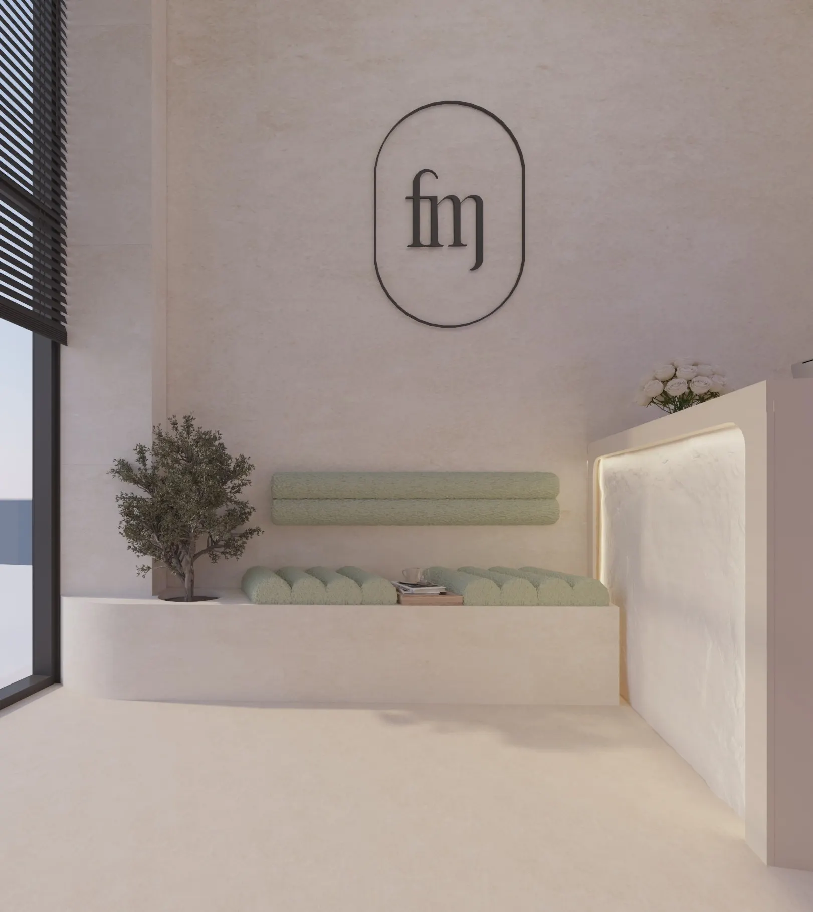 Waiting area with a built-in plaster bench, sage green bouclé cushions, an olive tree and the salon logo on the wall
